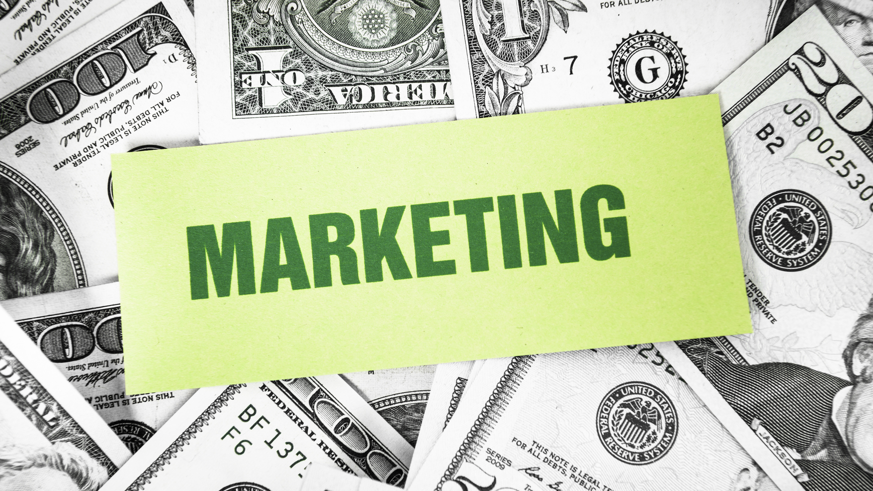 Bunch of dollars with marketing card